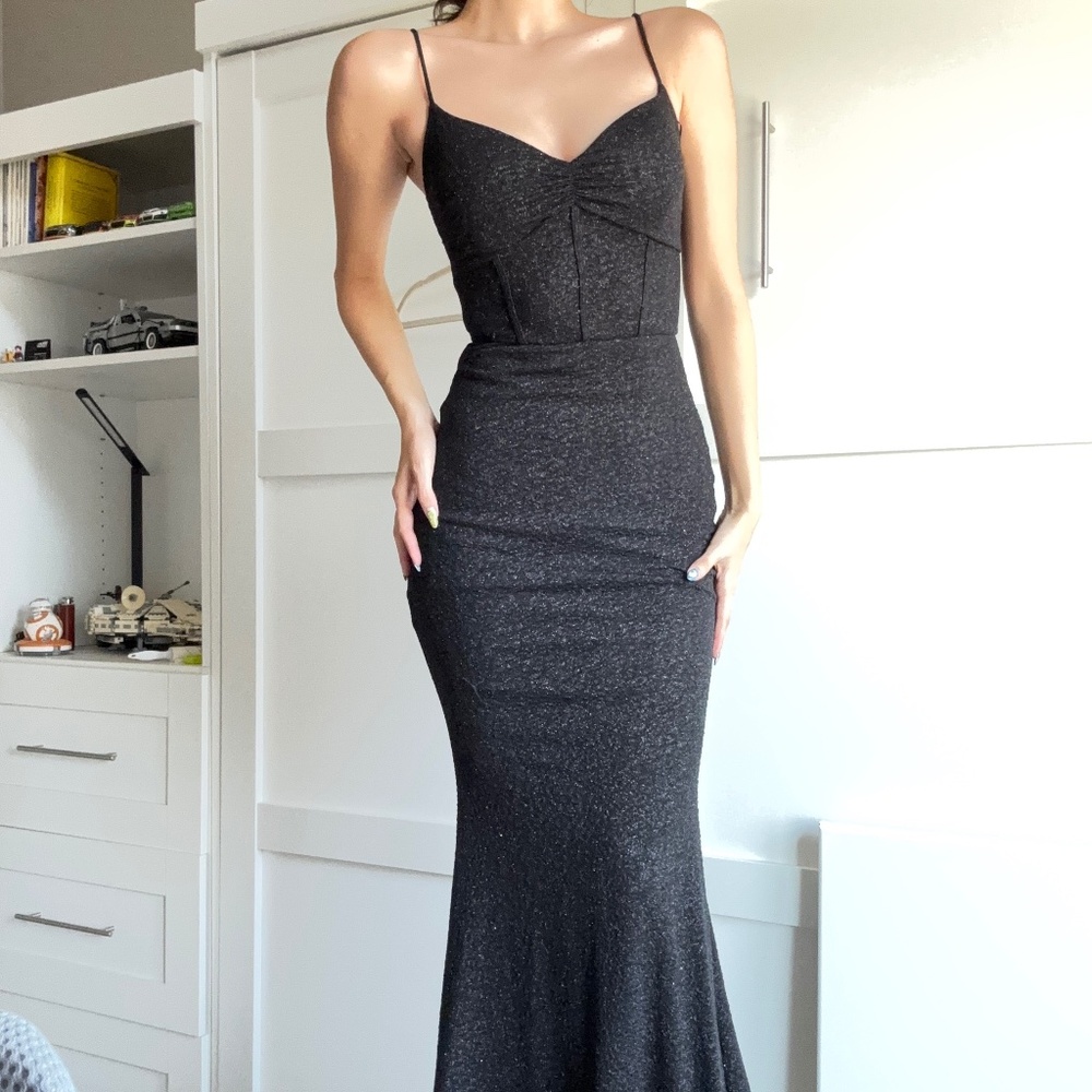 A long black prom dress that hugs the figure just right.